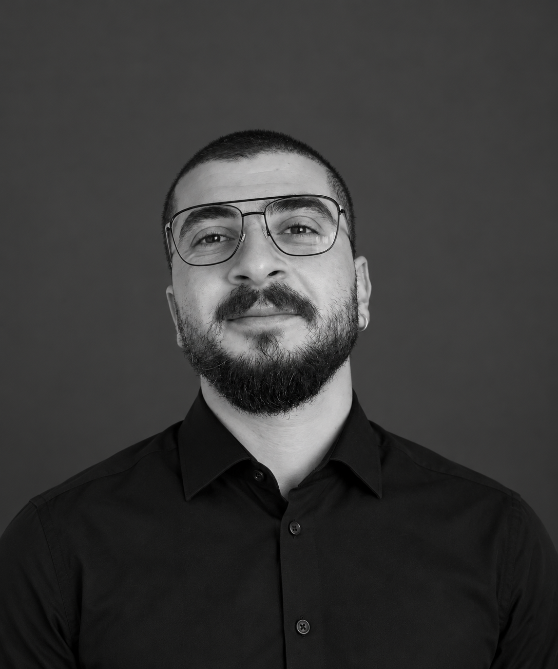 Black-and-white portrait of Ehab Arous